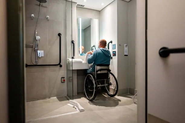 Participant using an accessible bathroom in supported accommodation